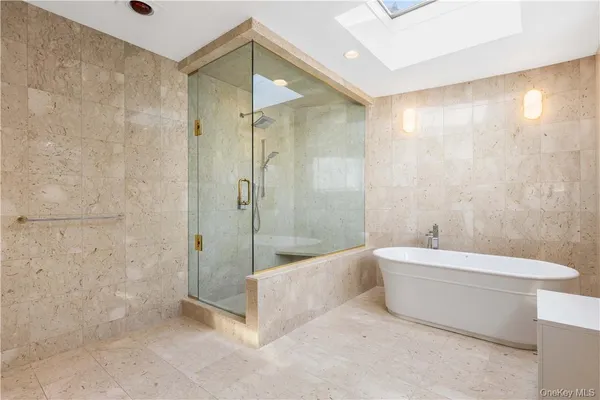 a bathroom with a tub and a window