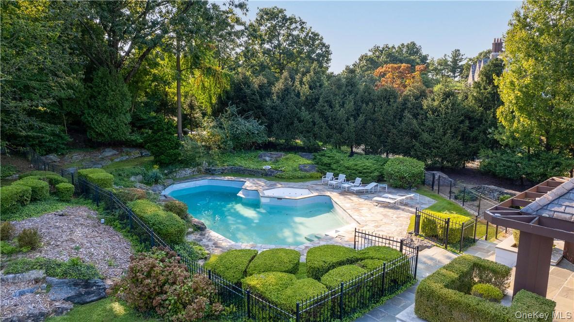 40 Polly Park Road Rye, NY 10580 - Photo 2 of 36 a view of a swimming pool with a yard