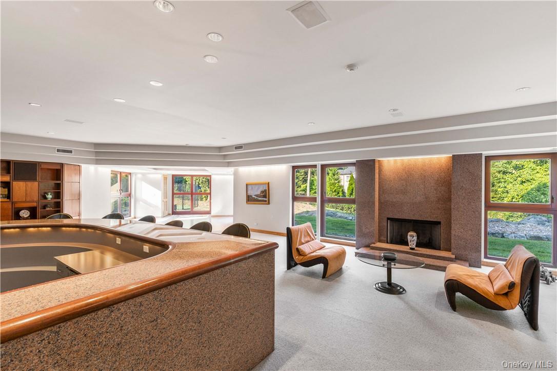 40 Polly Park Road Rye, NY 10580 - Photo 28 of 36 a living room with furniture and a fireplace