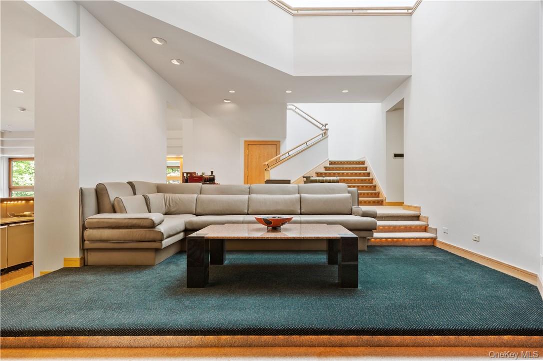 40 Polly Park Road Rye, NY 10580 - Photo 29 of 36 a living room with furniture a rug and white walls