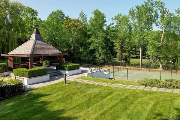 a view of a swimming pool with a patio