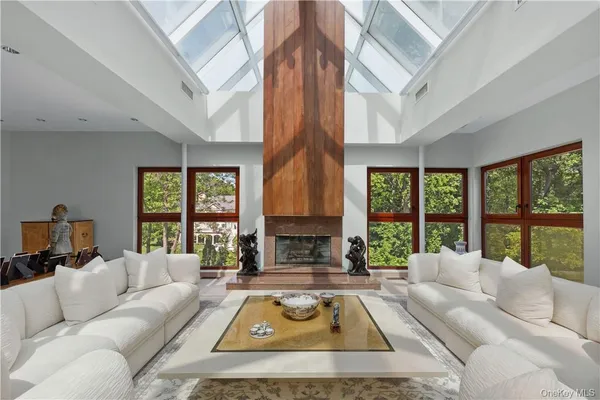 a living room with furniture a chandelier and a chandelier