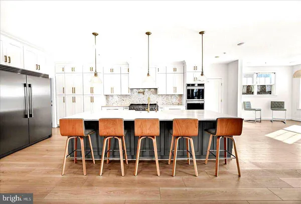 a bathroom with a sink a mirror and toilet