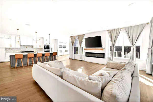 a bedroom with a bed and a flat tv screen