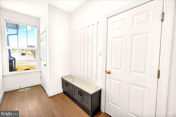 a bedroom with a bed and dresser