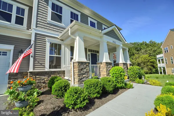 a view of a big yard with a tree in the background