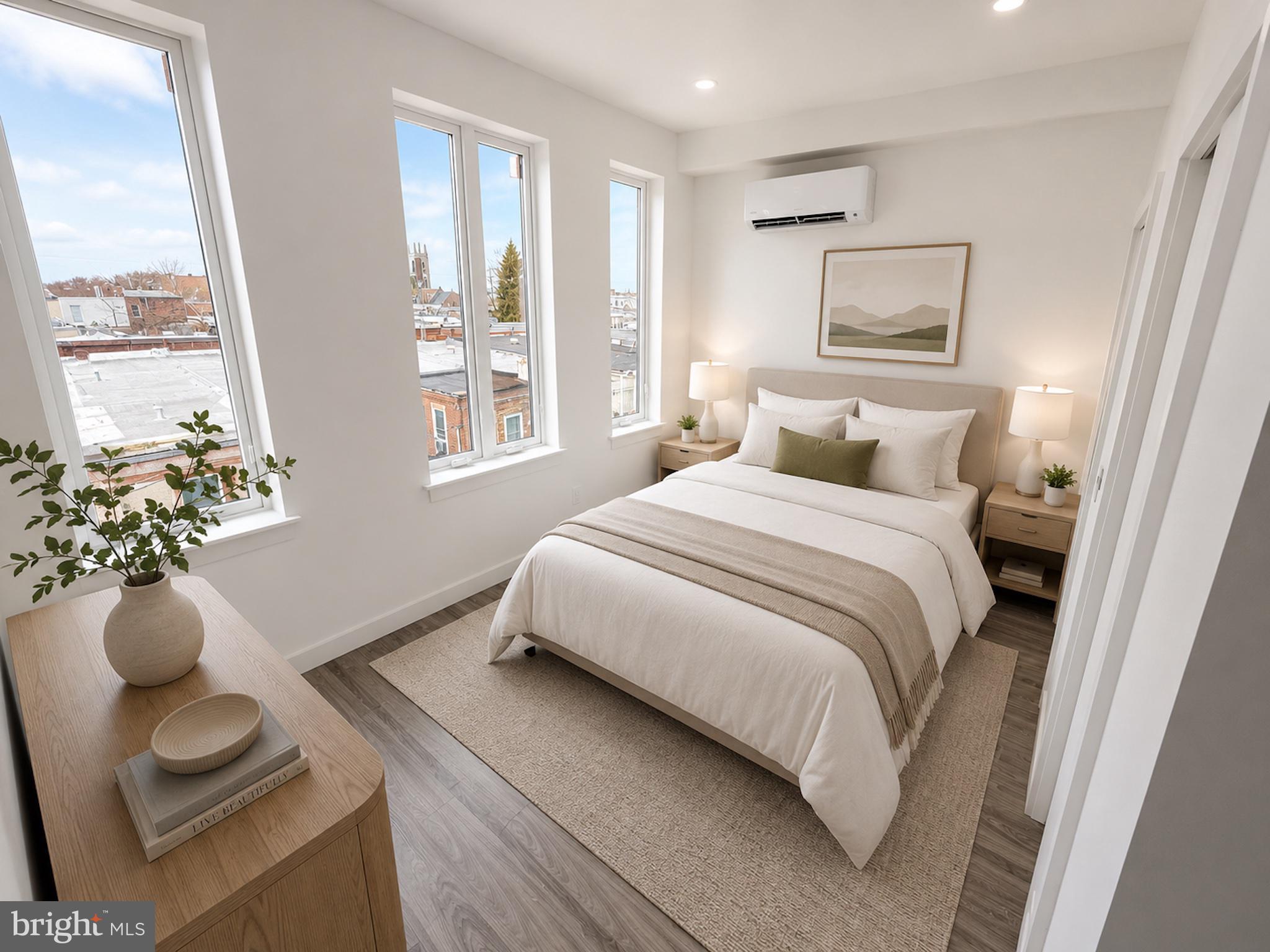 2614 North 7th Street, Unit 2 Philadelphia, PA 19133 - Photo 3 of 10 a bedroom with a bed and a potted plant
