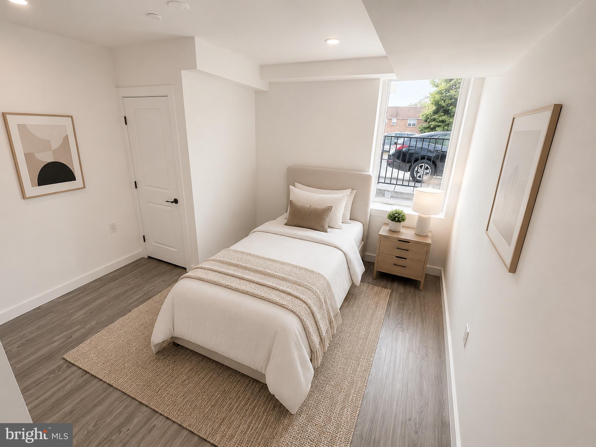 2614 North 7th Street, Unit 2 Philadelphia, PA 19133 - Photo 5 of 10 a bedroom with a bed and a refrigerator