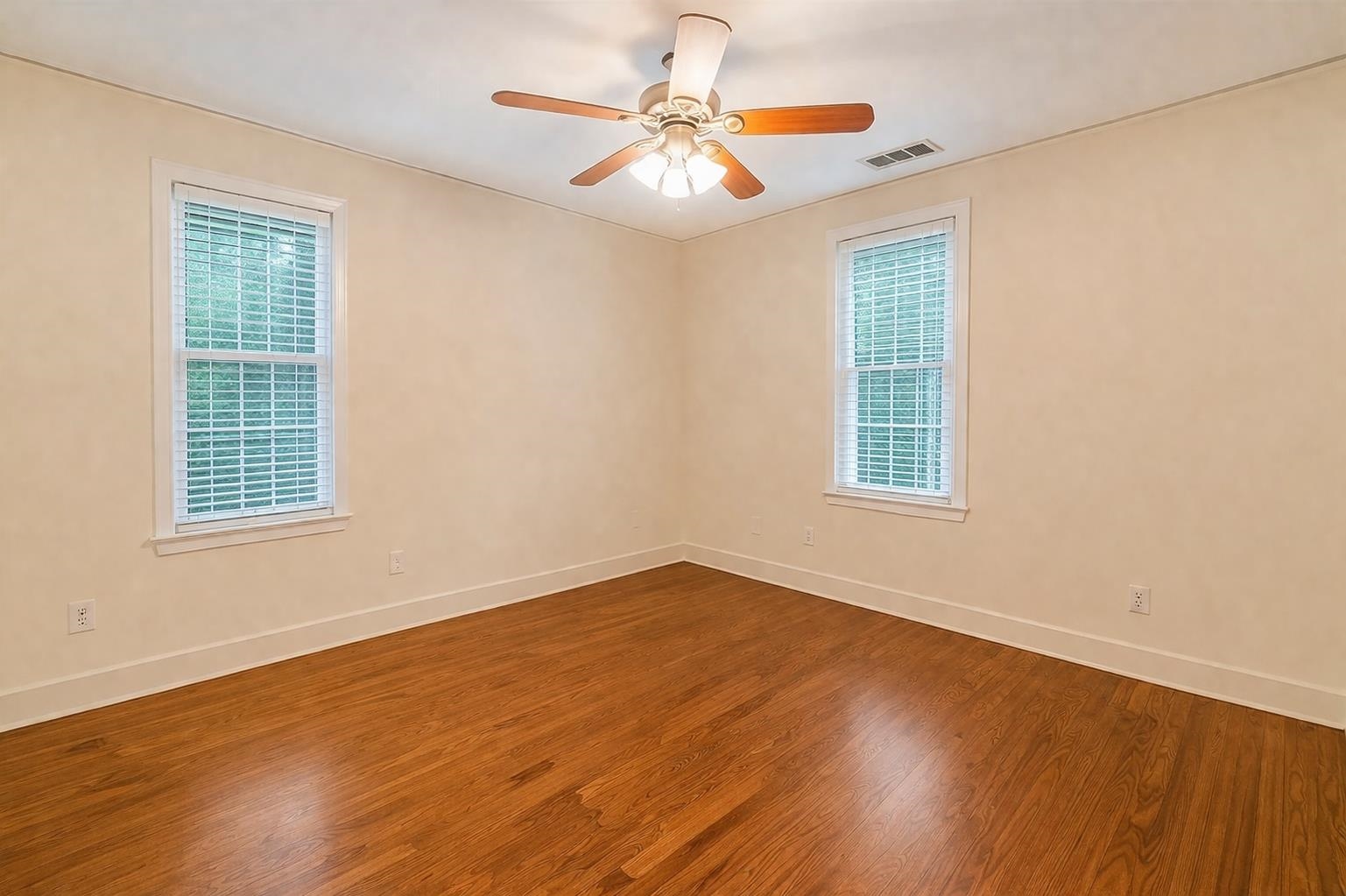 705 Loeb Street Memphis, TN 38111 - Photo 13 of 16 a view of an empty room with window and wooden floor