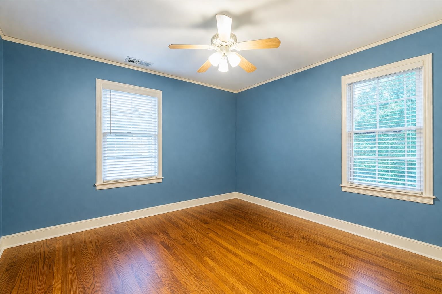 705 Loeb Street Memphis, TN 38111 - Photo 14 of 16 a view of an empty room with window and wooden floor