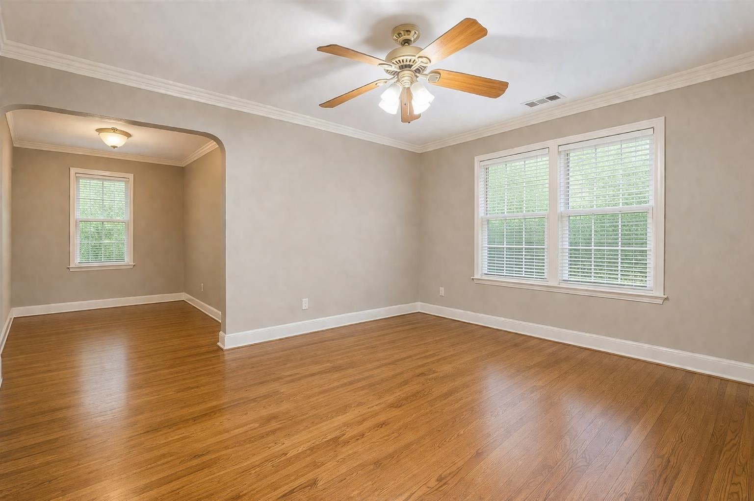 705 Loeb Street Memphis, TN 38111 - Photo 6 of 16 a view of an empty room with wooden floor and a window
