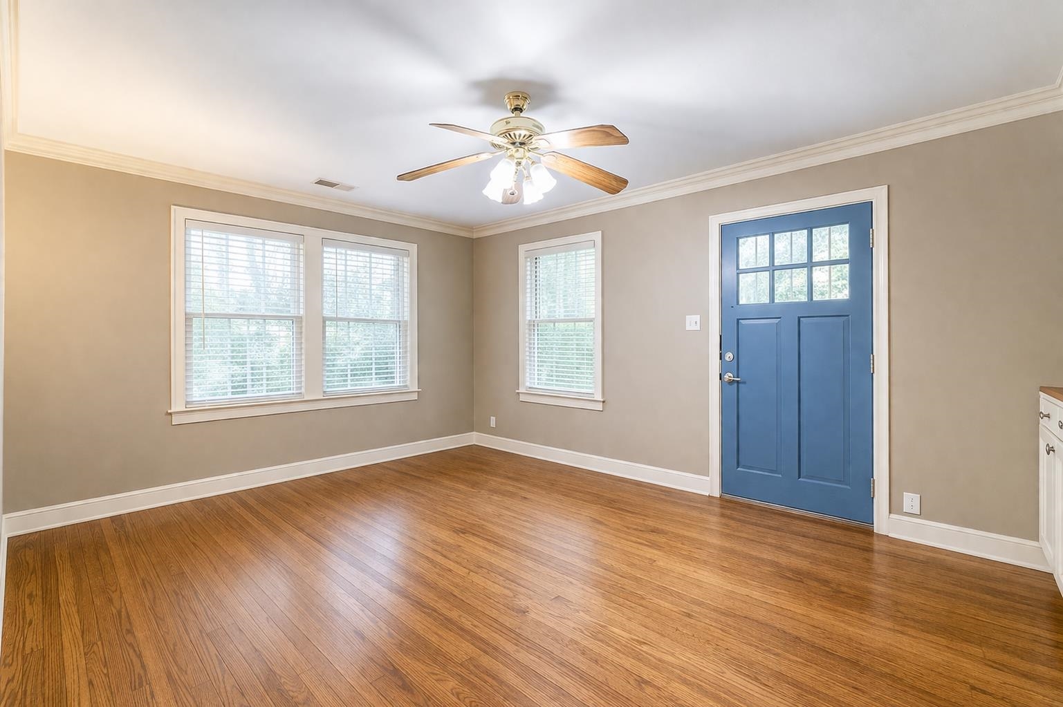 705 Loeb Street Memphis, TN 38111 - Photo 7 of 16 a view of an empty room with wooden floor and a window