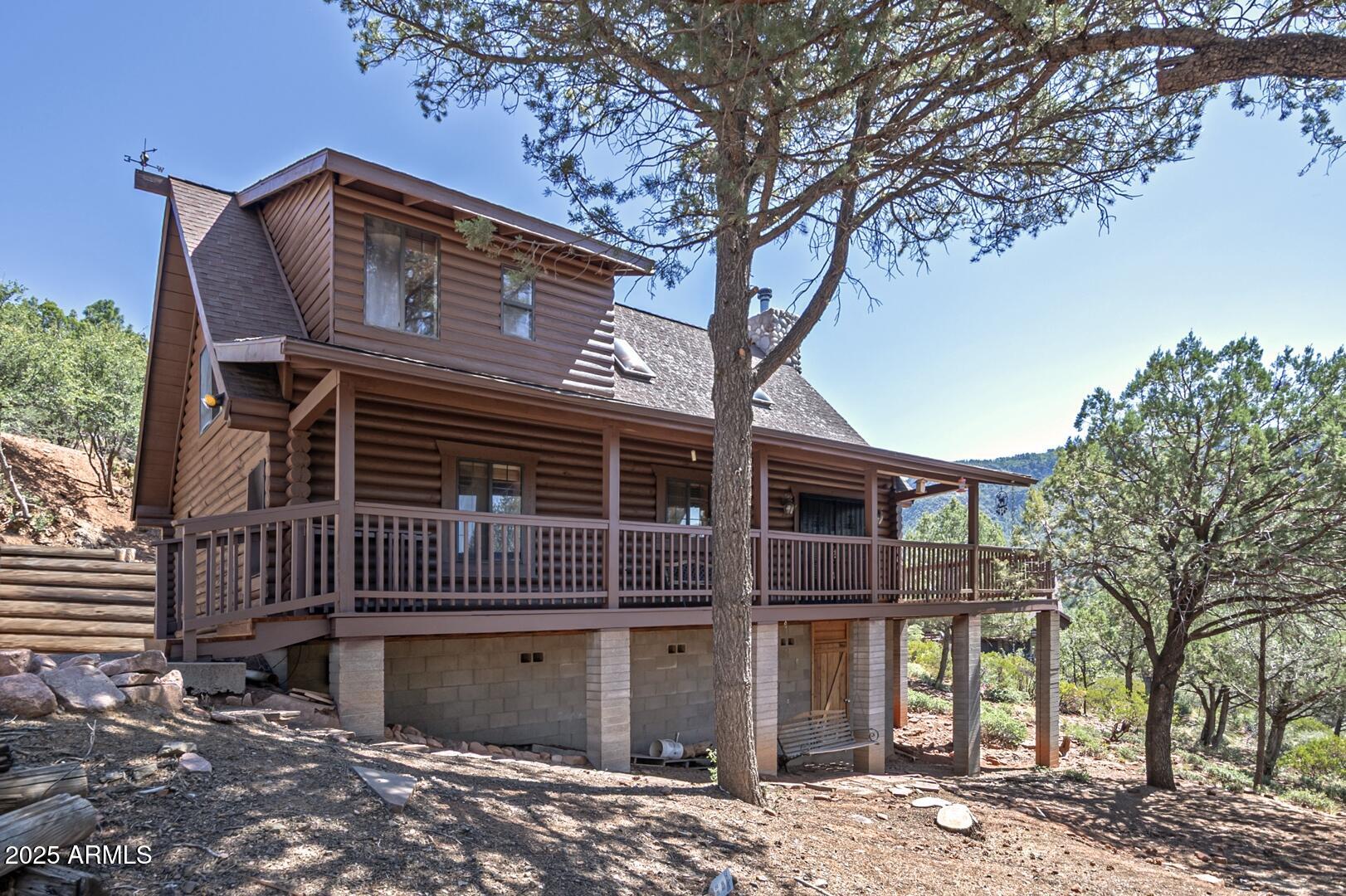 5945 Arroyo Way Pine, AZ 85544 - Photo 11 of 38 a front view of a house with garden