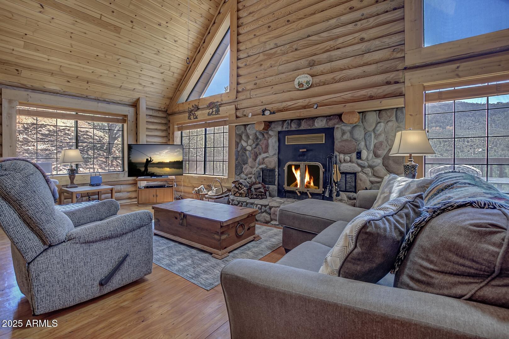 5945 Arroyo Way Pine, AZ 85544 - Photo 14 of 38 a living room with furniture and a fireplace