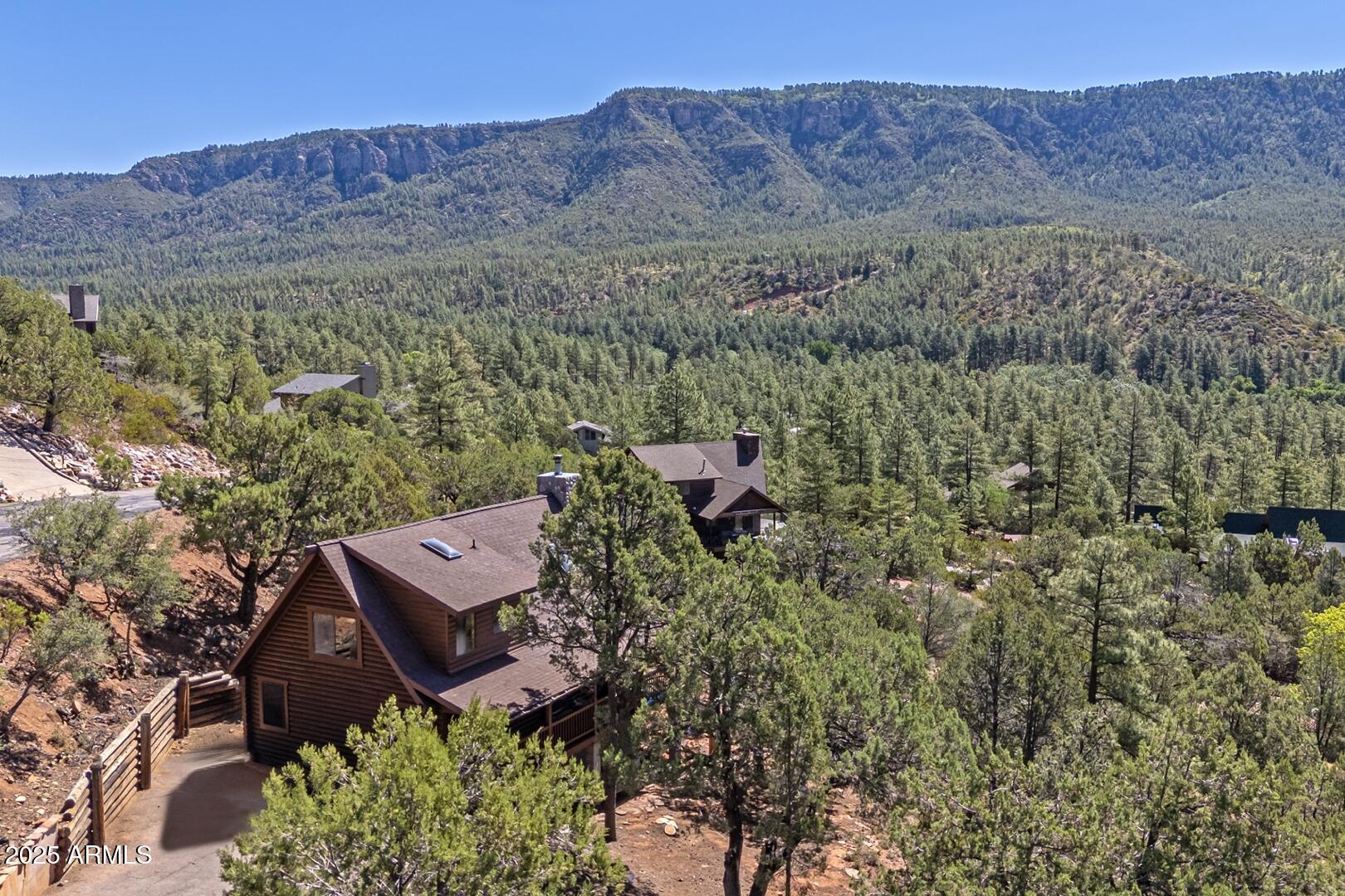 5945 Arroyo Way Pine, AZ 85544 - Photo 2 of 38 an aerial view of a house with mountain view