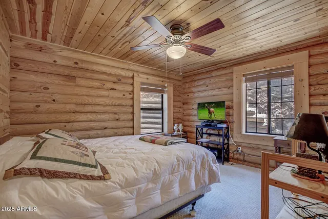a living room with furniture and fireplace