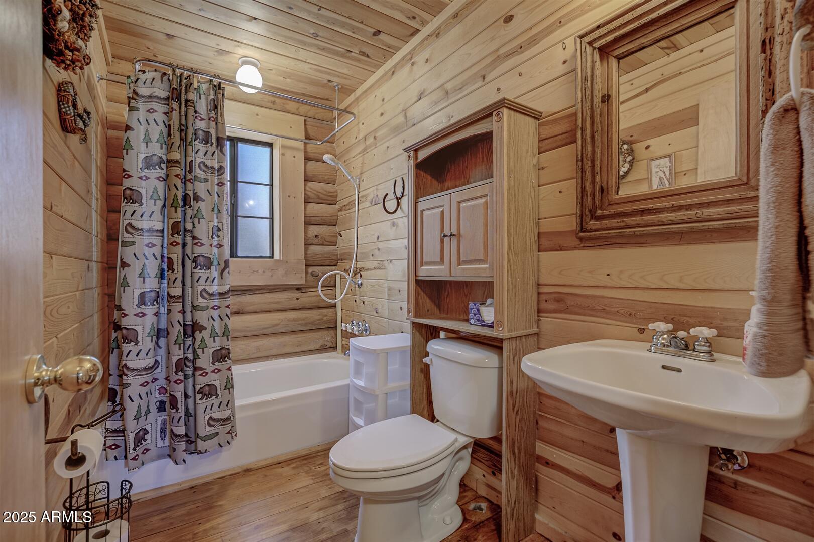 5945 Arroyo Way Pine, AZ 85544 - Photo 22 of 38 a bathroom with a sink toilet and shower