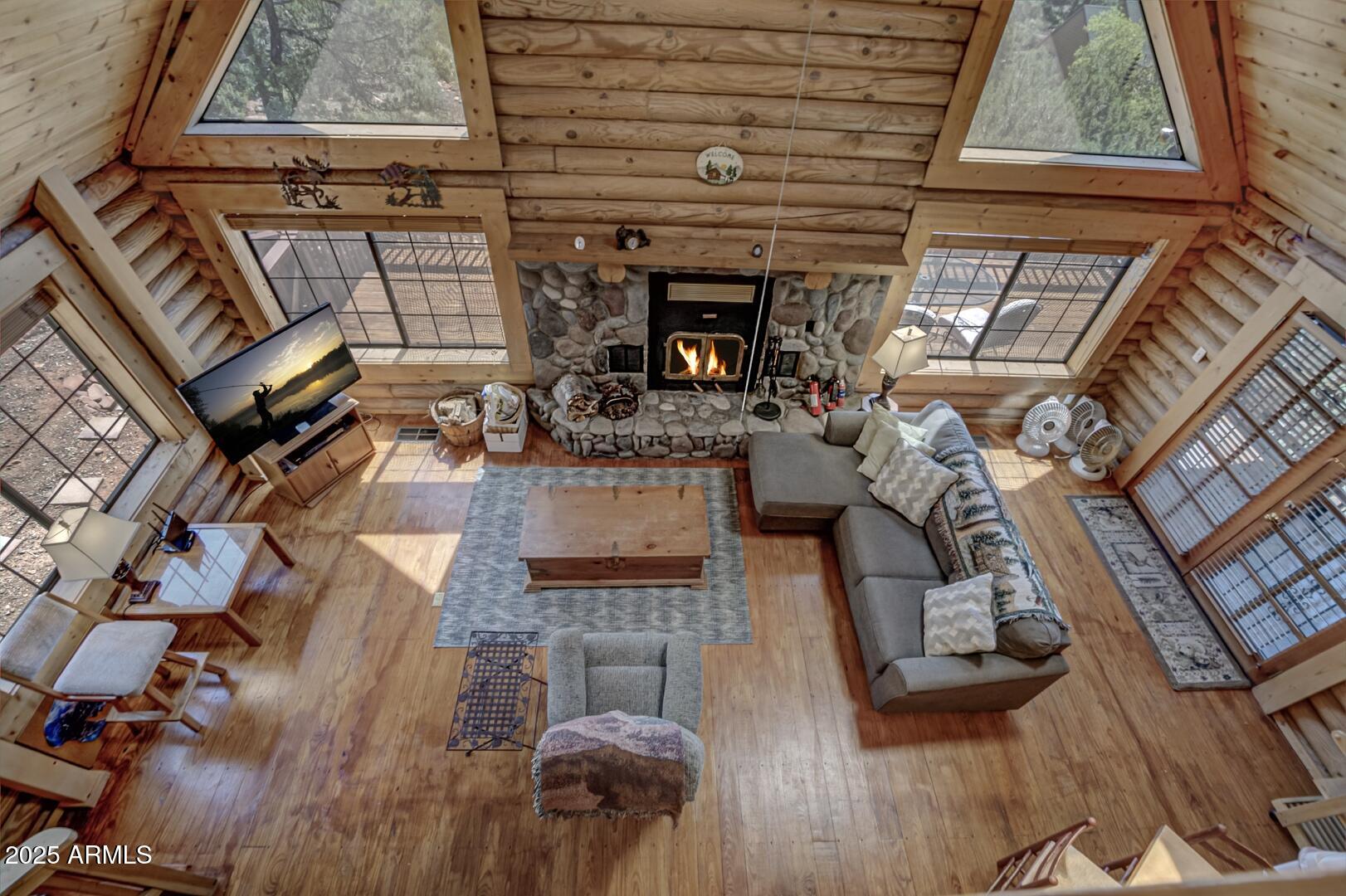 5945 Arroyo Way Pine, AZ 85544 - Photo 23 of 38 a living room with furniture and fireplace