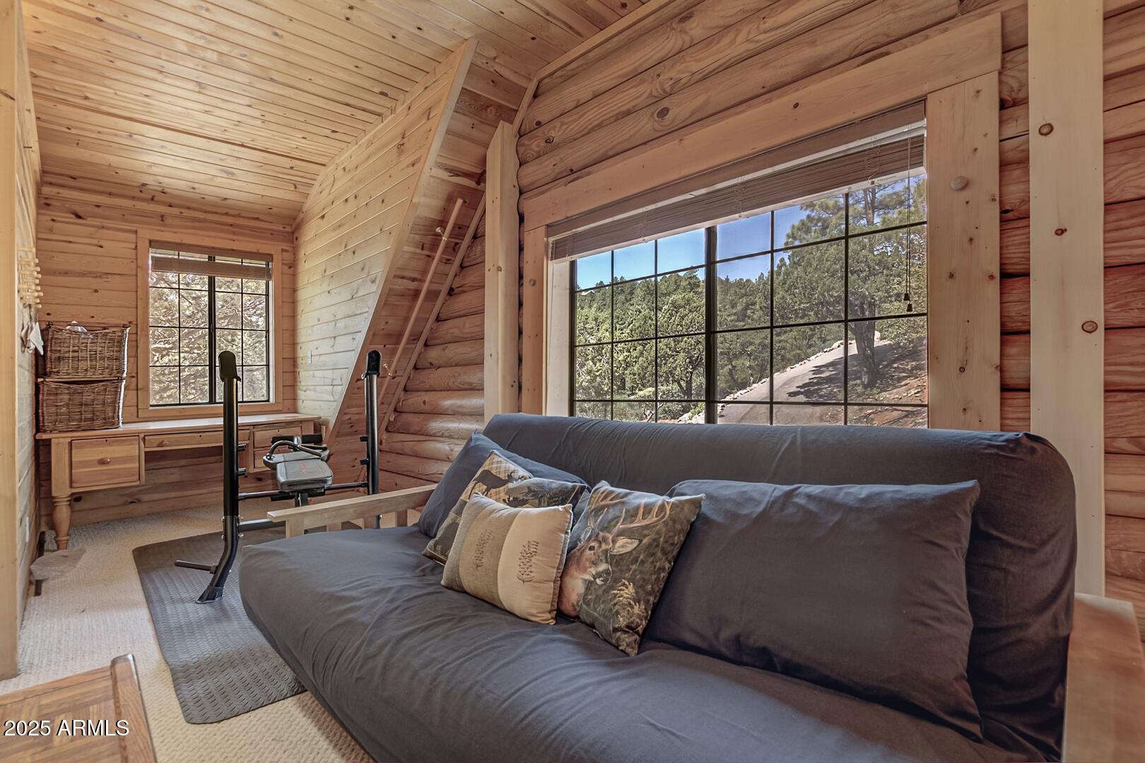 5945 Arroyo Way Pine, AZ 85544 - Photo 26 of 38 a living room with furniture and a large window