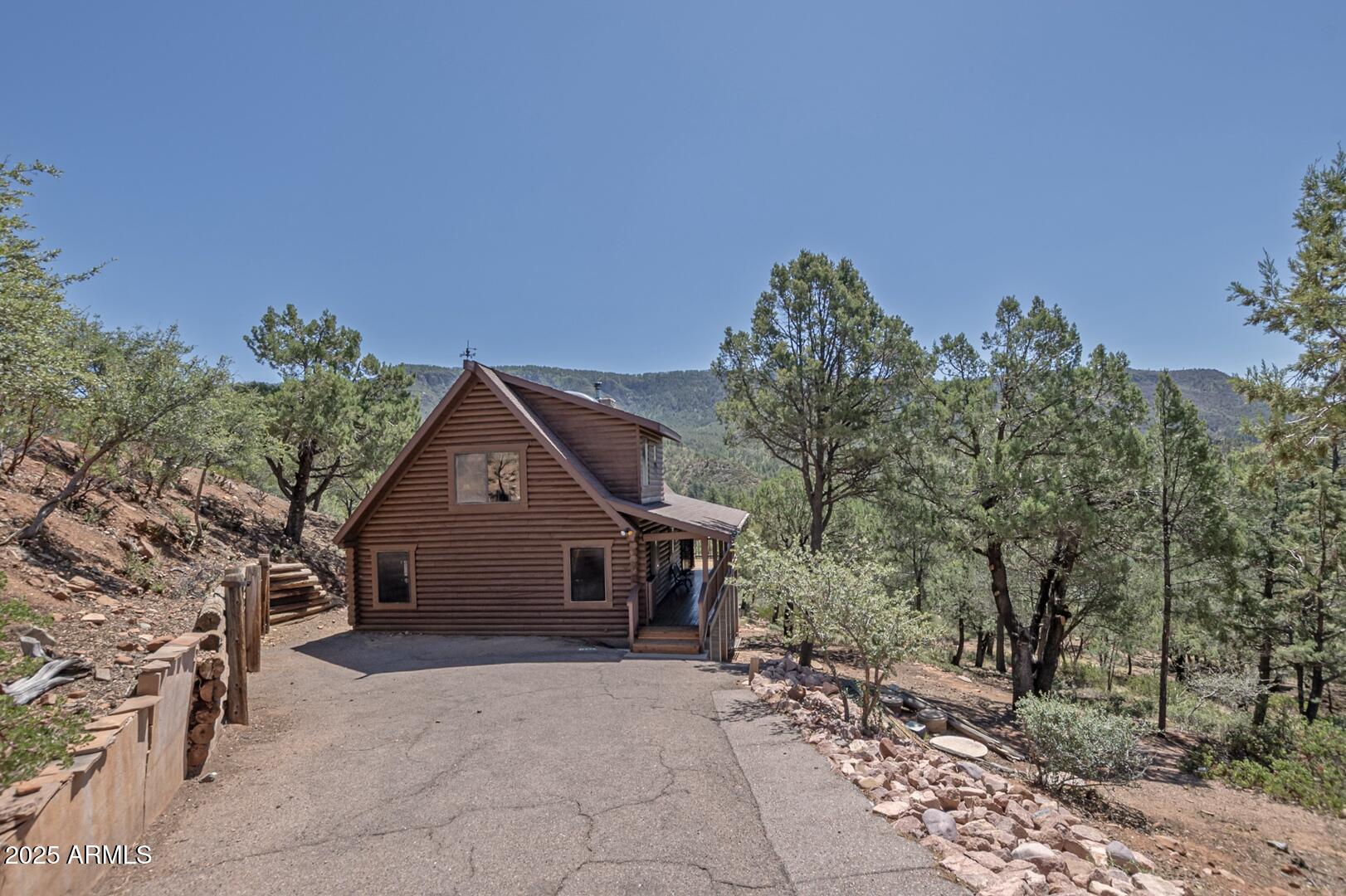 5945 Arroyo Way Pine, AZ 85544 - Photo 29 of 38 a front view of a house with a yard