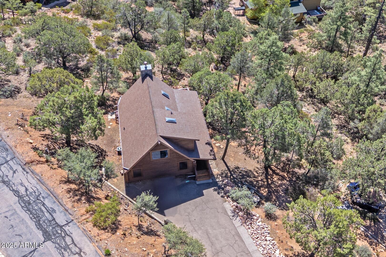 5945 Arroyo Way Pine, AZ 85544 - Photo 31 of 38 an aerial view of a house with a yard and large tree