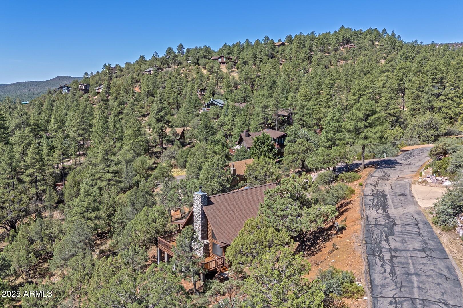 5945 Arroyo Way Pine, AZ 85544 - Photo 32 of 38 an aerial view of a house with a yard