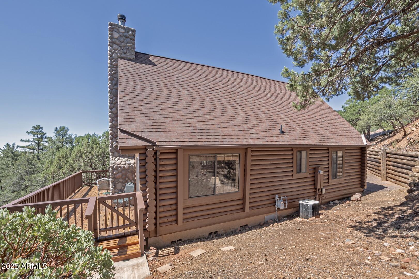 5945 Arroyo Way Pine, AZ 85544 - Photo 37 of 38 a backyard of a house with seating space