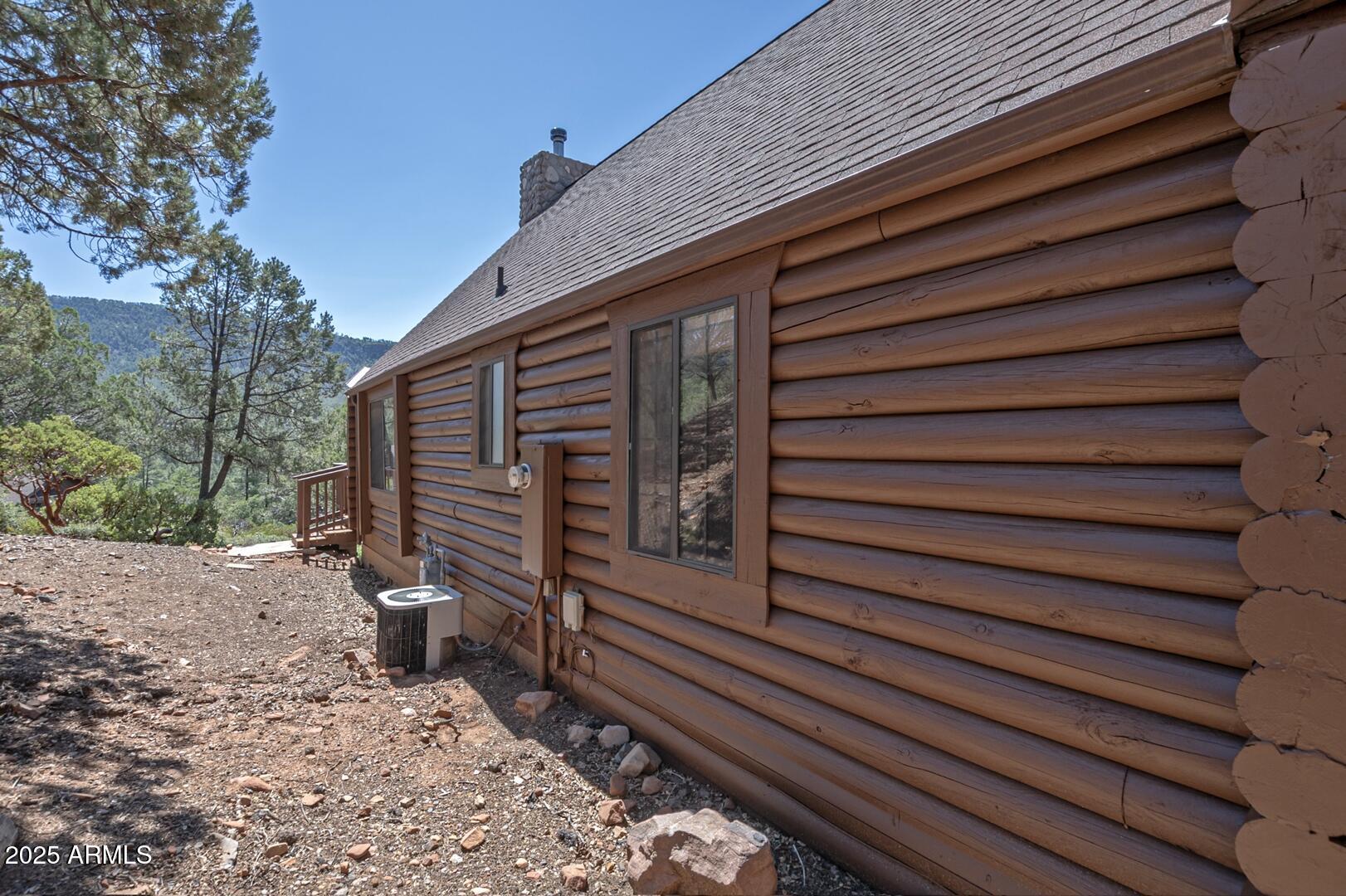 5945 Arroyo Way Pine, AZ 85544 - Photo 38 of 38 a view of a house with a wooden fence