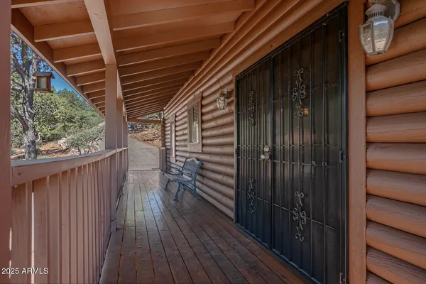 a view of a balcony with wooden floor