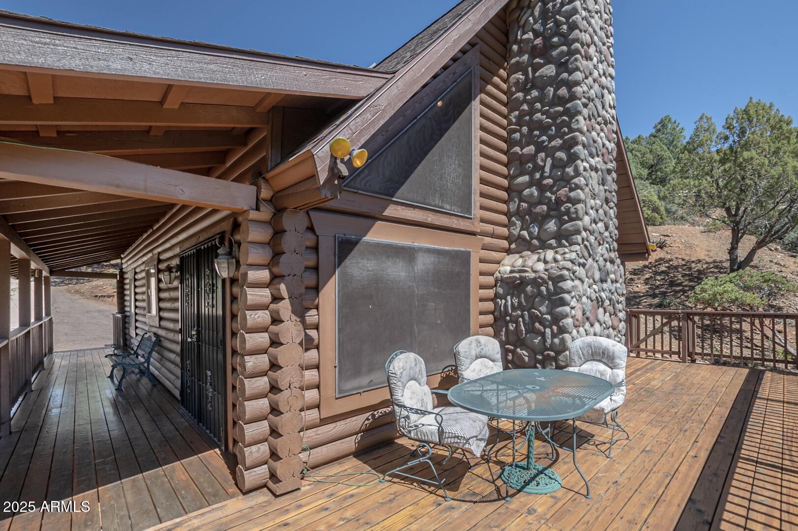 5945 Arroyo Way Pine, AZ 85544 - Photo 8 of 38 a backyard of a house with table and chairs