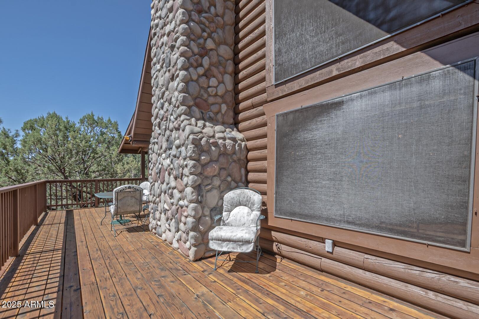 5945 Arroyo Way Pine, AZ 85544 - Photo 9 of 38 a view of a balcony with wooden floor