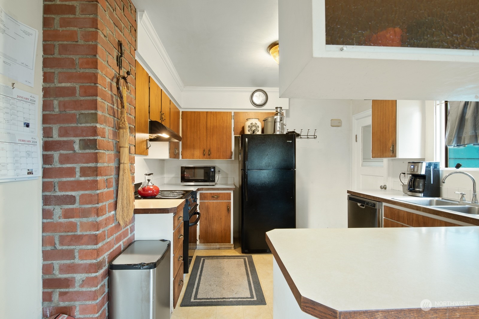 5709 Putnam Road Everson, WA 98247 - Photo 15 of 40 a kitchen with cabinets and stainless steel appliances
