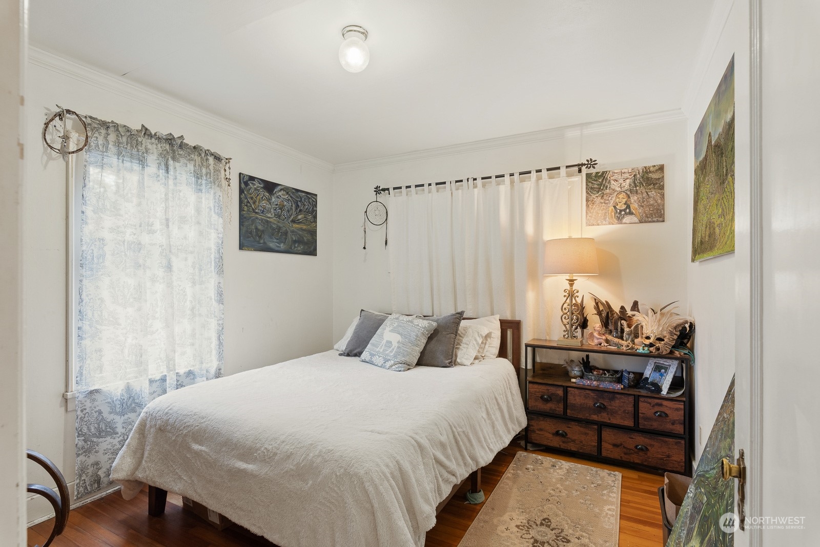 5709 Putnam Road Everson, WA 98247 - Photo 17 of 40 a bedroom with a bed and wooden floor