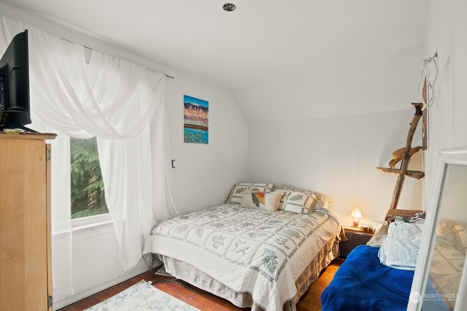 5709 Putnam Road Everson, WA 98247 - Photo 22 of 40 a bedroom with a bed next to a window