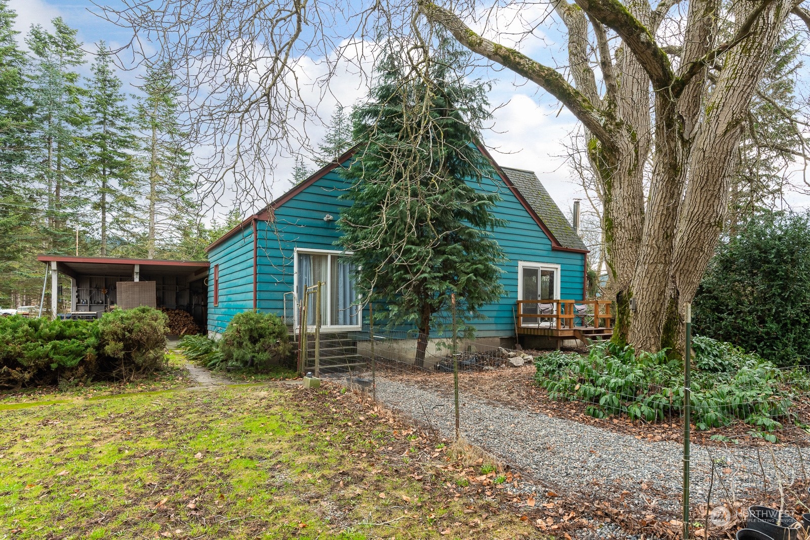 5709 Putnam Road Everson, WA 98247 - Photo 6 of 40 a backyard of a house with plants and outdoor seating