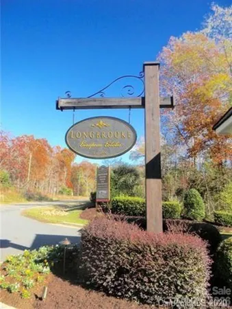 a view of a swimming pool with a yard