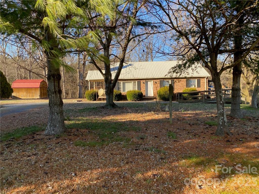 430 Russell Road Polkton, NC 28135 - Photo 1 of 18 a view of house with yard and green space