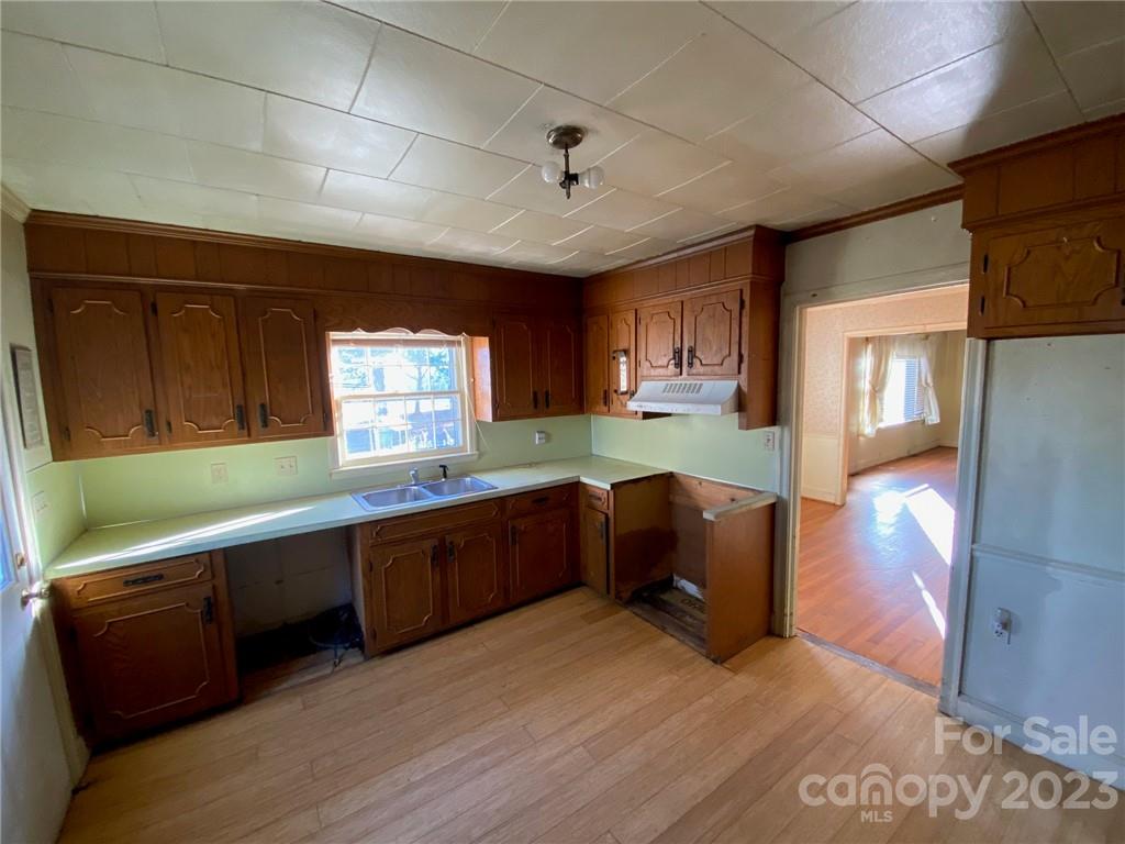 430 Russell Road Polkton, NC 28135 - Photo 12 of 18 a kitchen with stainless steel appliances granite countertop a sink and a refrigerator