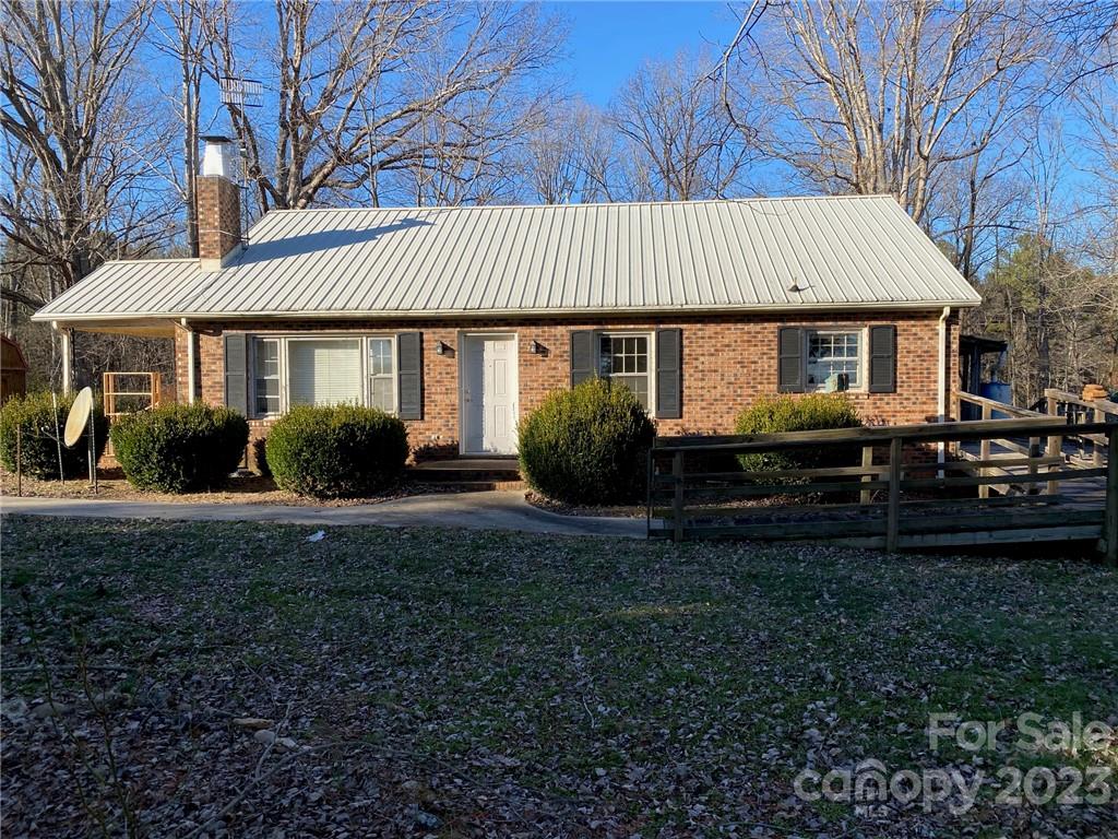 430 Russell Road Polkton, NC 28135 - Photo 2 of 18 a front view of a house with garden
