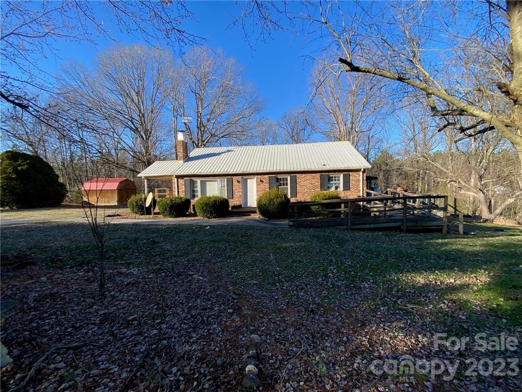 430 Russell Road Polkton, NC 28135 - Photo 3 of 18 a front view of a house with garden