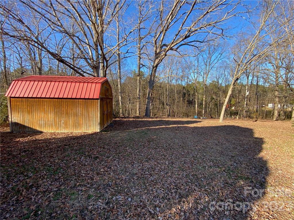430 Russell Road Polkton, NC 28135 - Photo 6 of 18 a view of outdoor space with trees