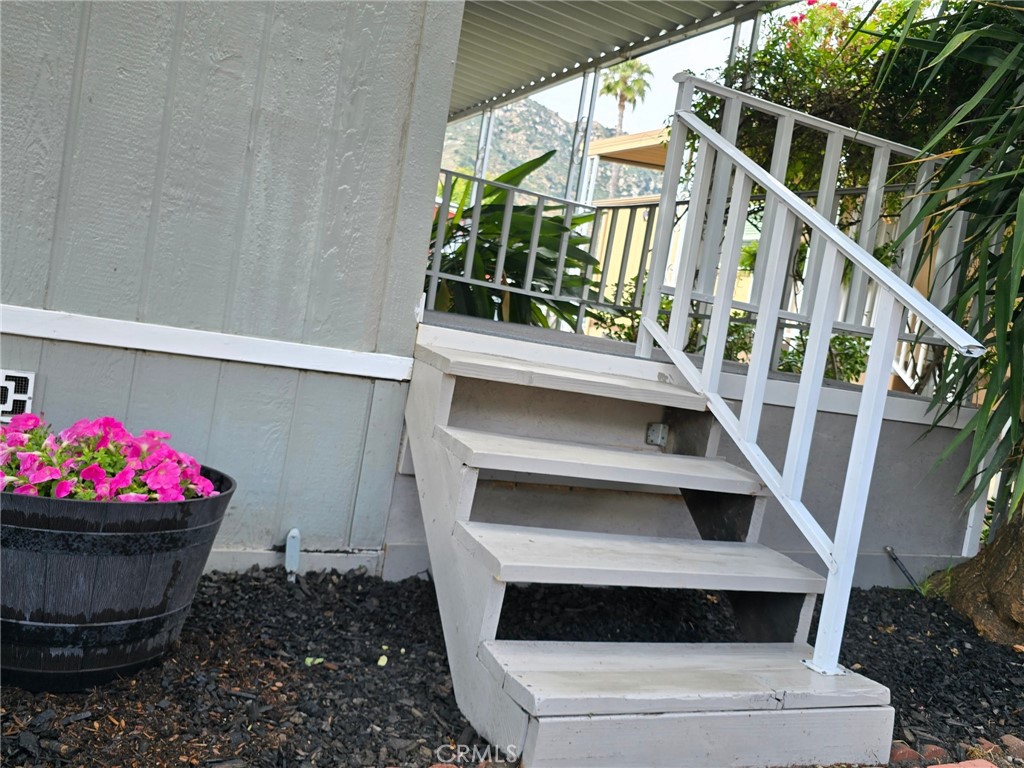 32900 Riverside Drive, Unit 94 Lake Elsinore, CA 92530 - Photo 4 of 23 Stairs leading to Primary Bedroom Patio