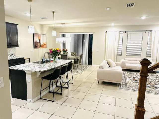 a living room with furniture and a table