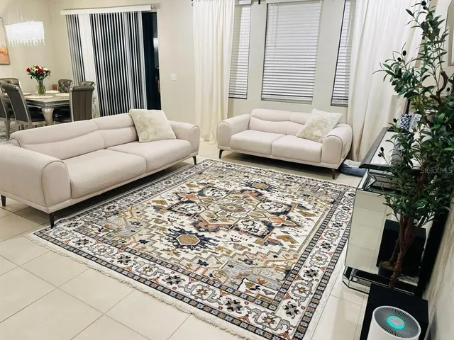 a living room with furniture and a couch