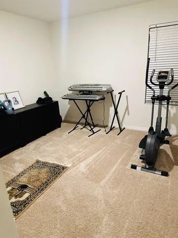 a view of a livingroom with furniture and a window