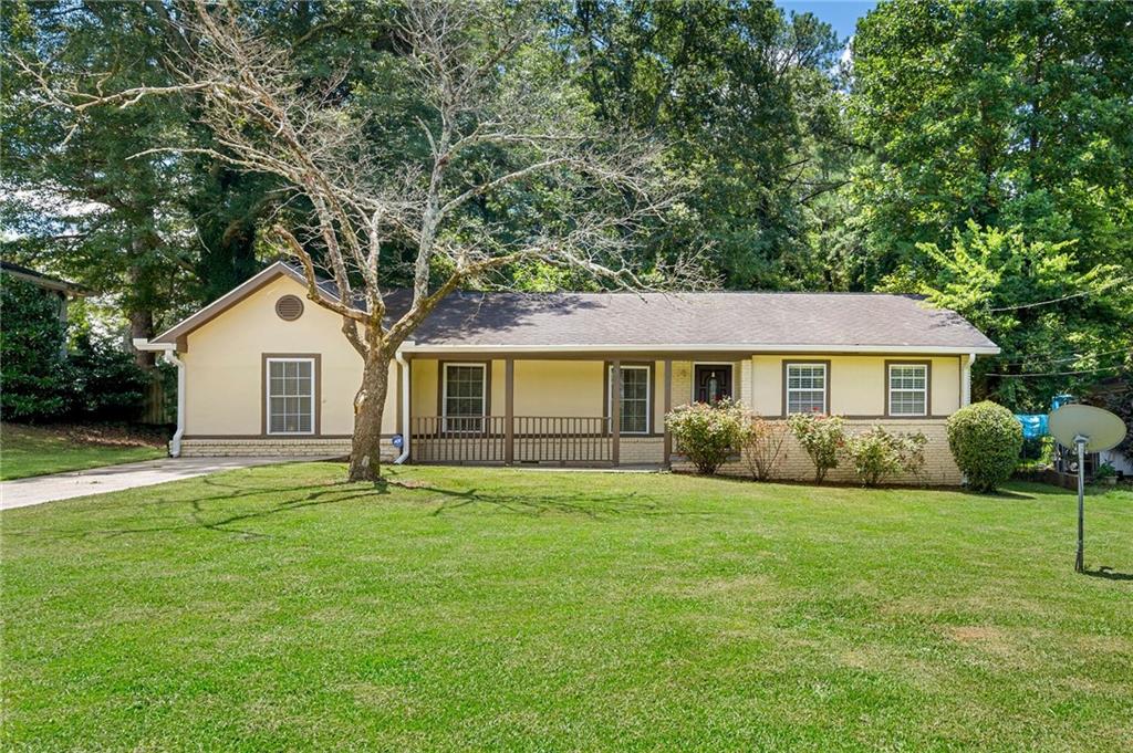3427 Springlake Drive Decatur, GA 30032 - Photo 1 of 1 a front view of a house with a yard and garage