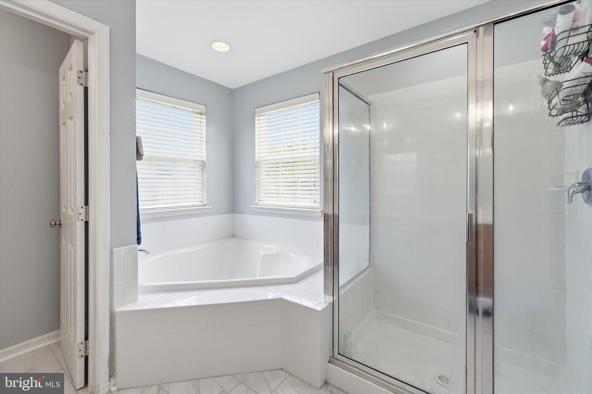 24 Overbrook Road Ranson, WV 25438 - Photo 11 of 21 a bathroom with a bathtub and a shower