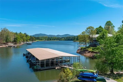 a swimming pool view with a lake view