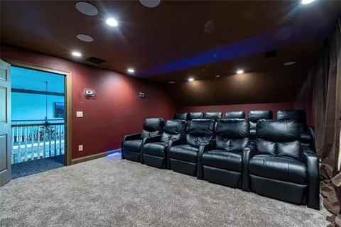 a media room with lots of chairs and a projector