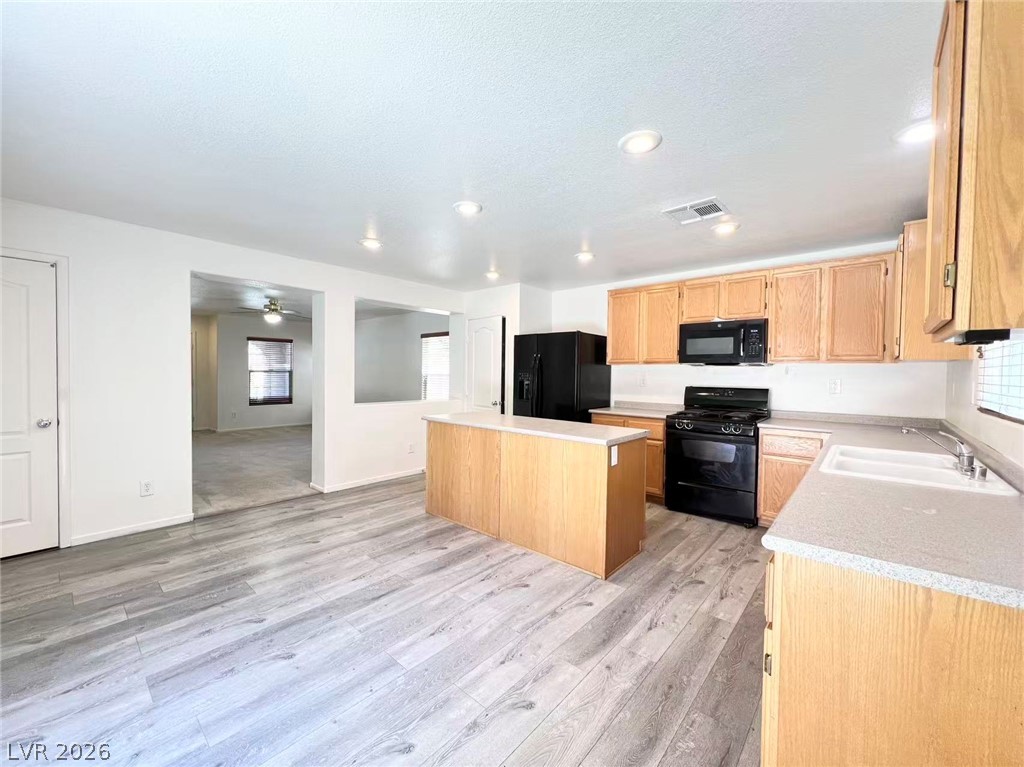 11143 Ranch Valley Street Las Vegas, NV 89179 - Photo 8 of 23 A versatile kitchen with an island, ideal for entertaining and daily living.